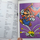 Illustration for article titled Mario Robs Banks, Waves the Union Jack for Proper English
